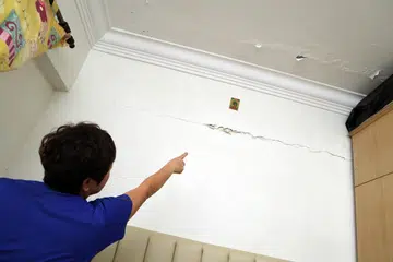 Bukit Batok resident claims solar panels installed on roof caused wall cracks, ceiling leaks