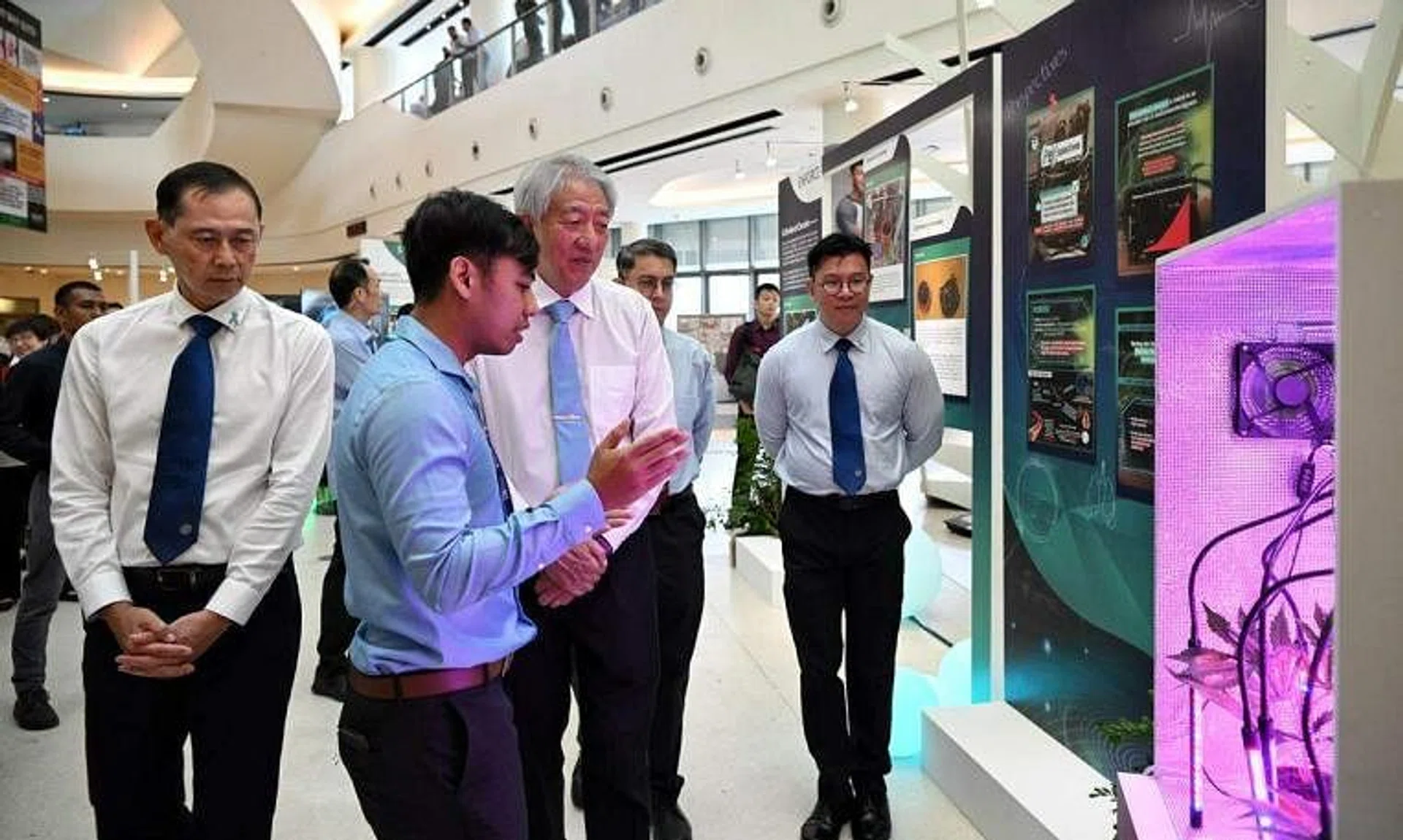 Senior Minister  Teo Chee Hean (third from left) being introduced to a mock-up of household cannabis cultivation at the Central Narcotics Bureau Workplan Seminar on May 3, 2023.