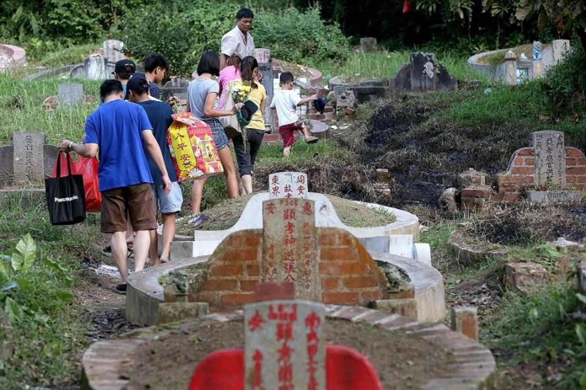REMAINING: Parts of Bukit Brown Cemetery have been razed to make way for a major road connecting the MacRitchie Viaduct to the Adam Flyover. 