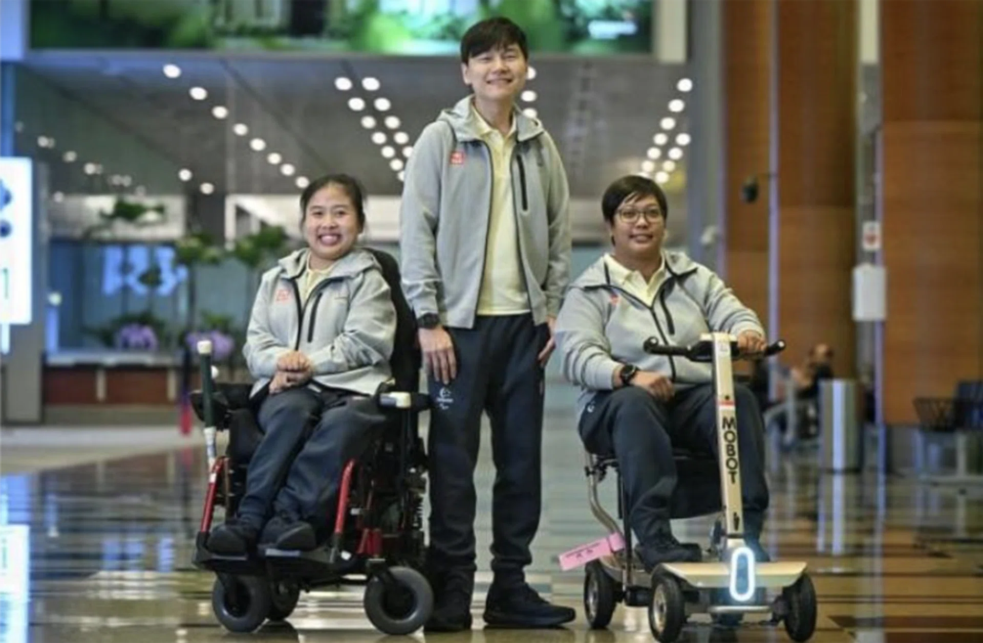 (From left) Boccia athlete Jeralyn Tan, shooter Daniel Chan and archer Nur Syahidah Alim at Changi Airport Terminal 3 on Aug 20, before flying off for the Paralympics. 