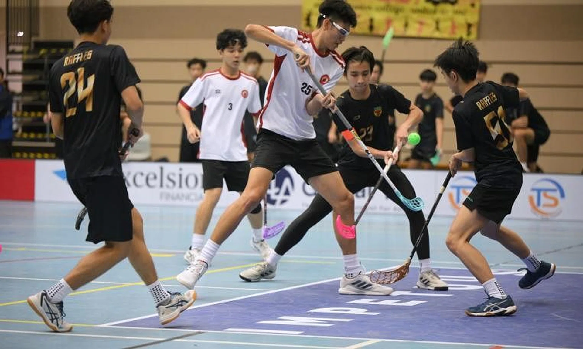 Victoria Junior College's Gerald Tan (centre in white) scored the winning penalty in the A Division boys' floorball final.