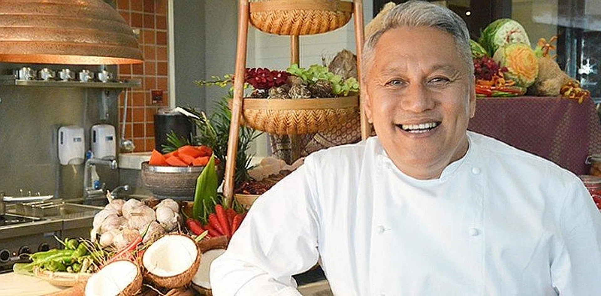 Chef Wan (above) and Ms Valerie Tang and husband Chan Eng Hua outside the Singapura Restaurant. 