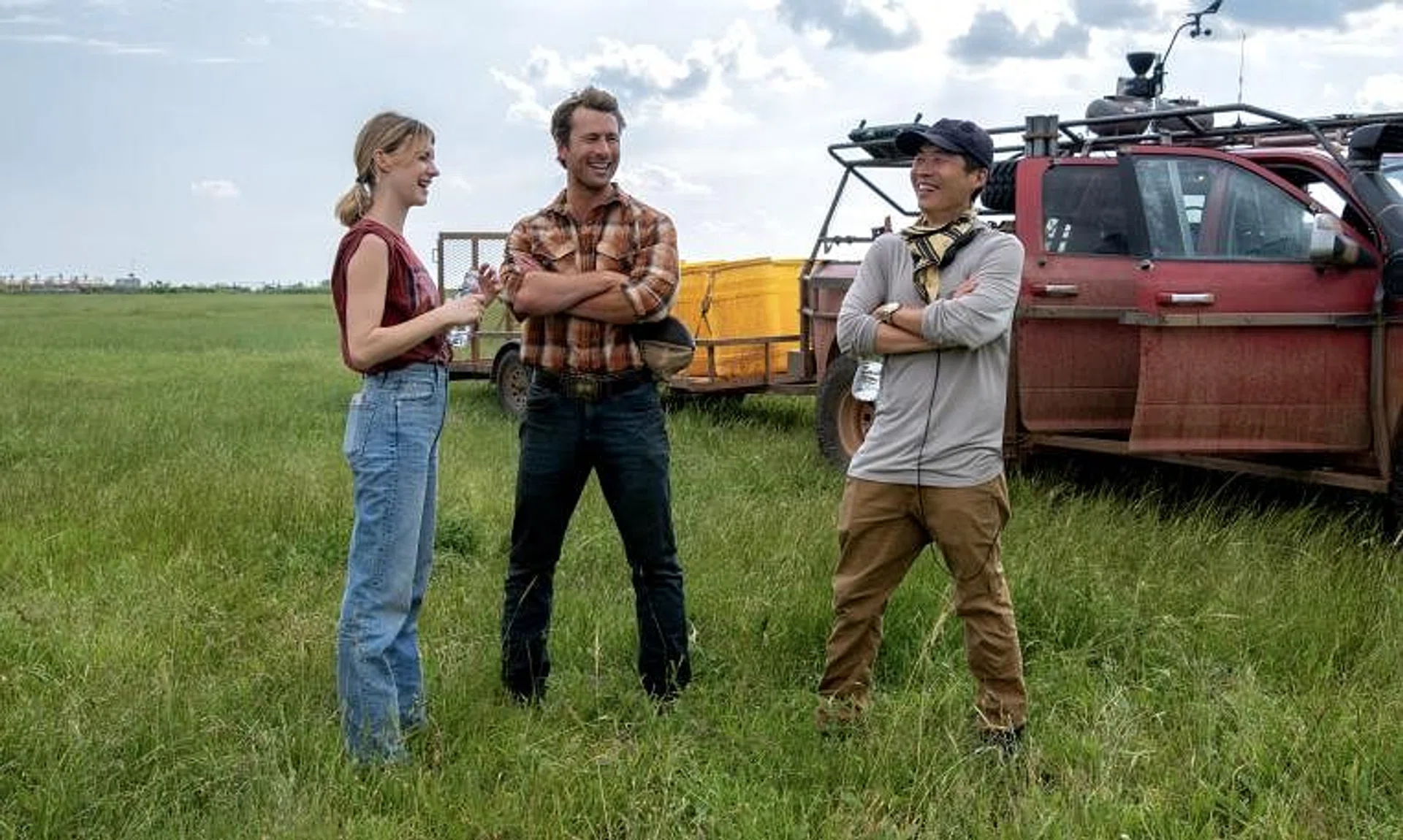 (From left) Actors Daisy Edgar-Jones and Glen Powell and director Lee Isaac Chung on the set of Twisters.