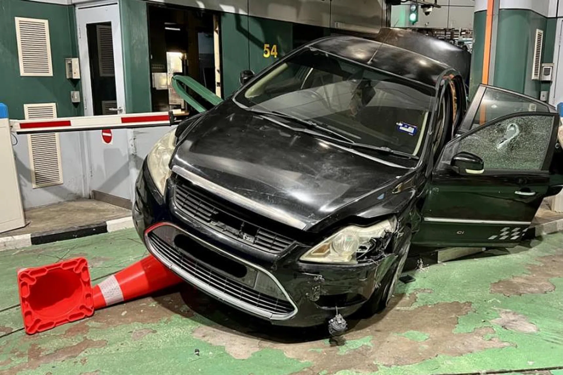 The driver, who had a tampered Singapore passport in his possession, and his two passengers were arrested.