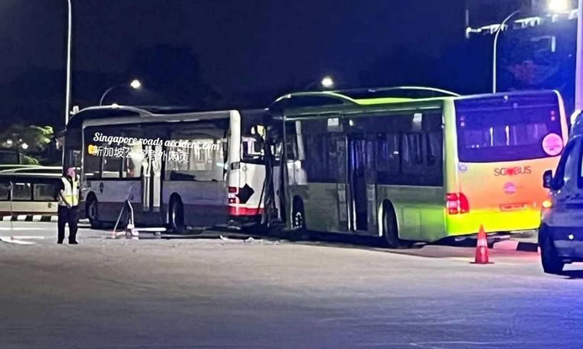 Photos of the incident’s aftermath show the front of a green bus wedged against the rear end of a white bus.