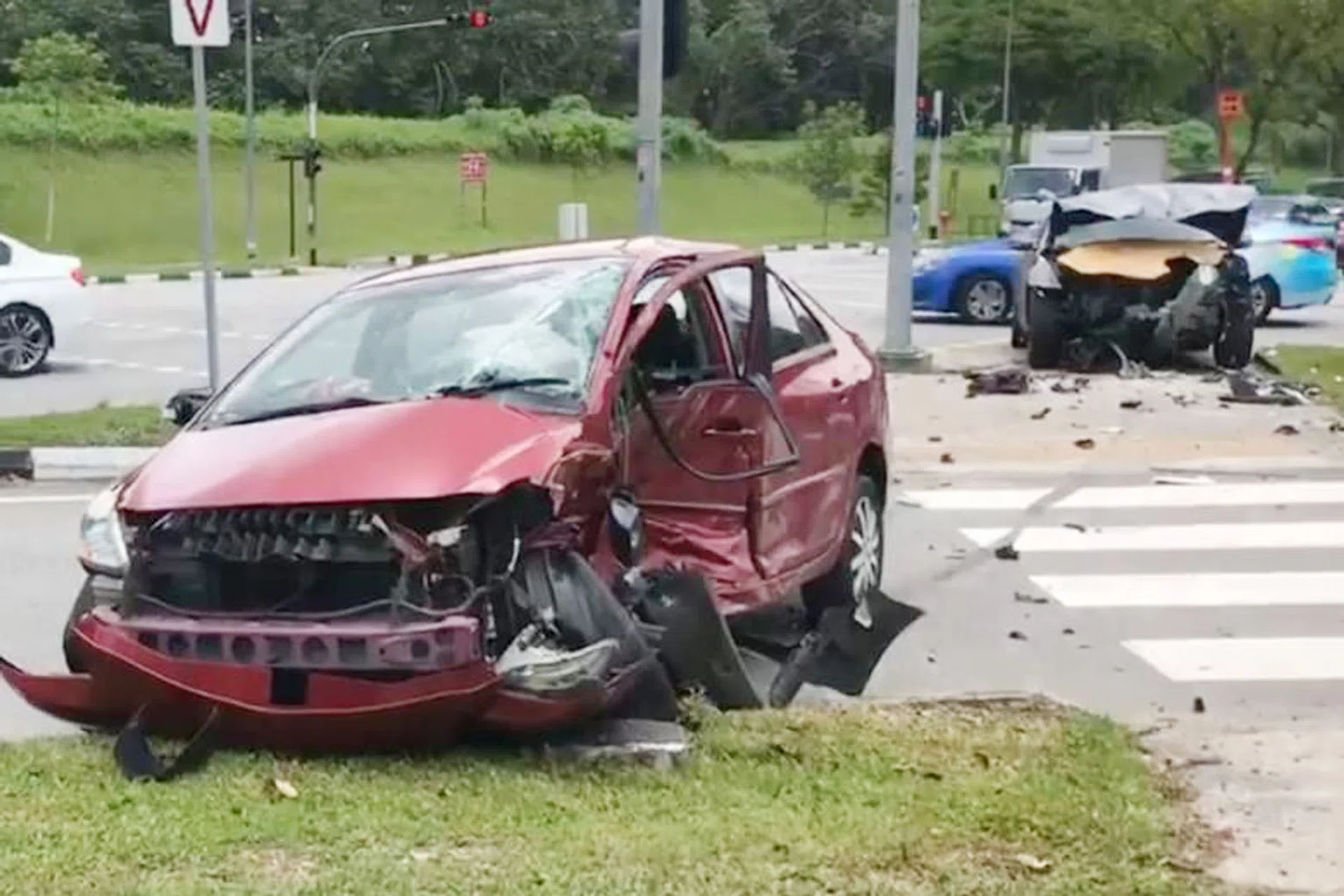 A screengrab of the video showing the two mangled cars on Mandai Road.