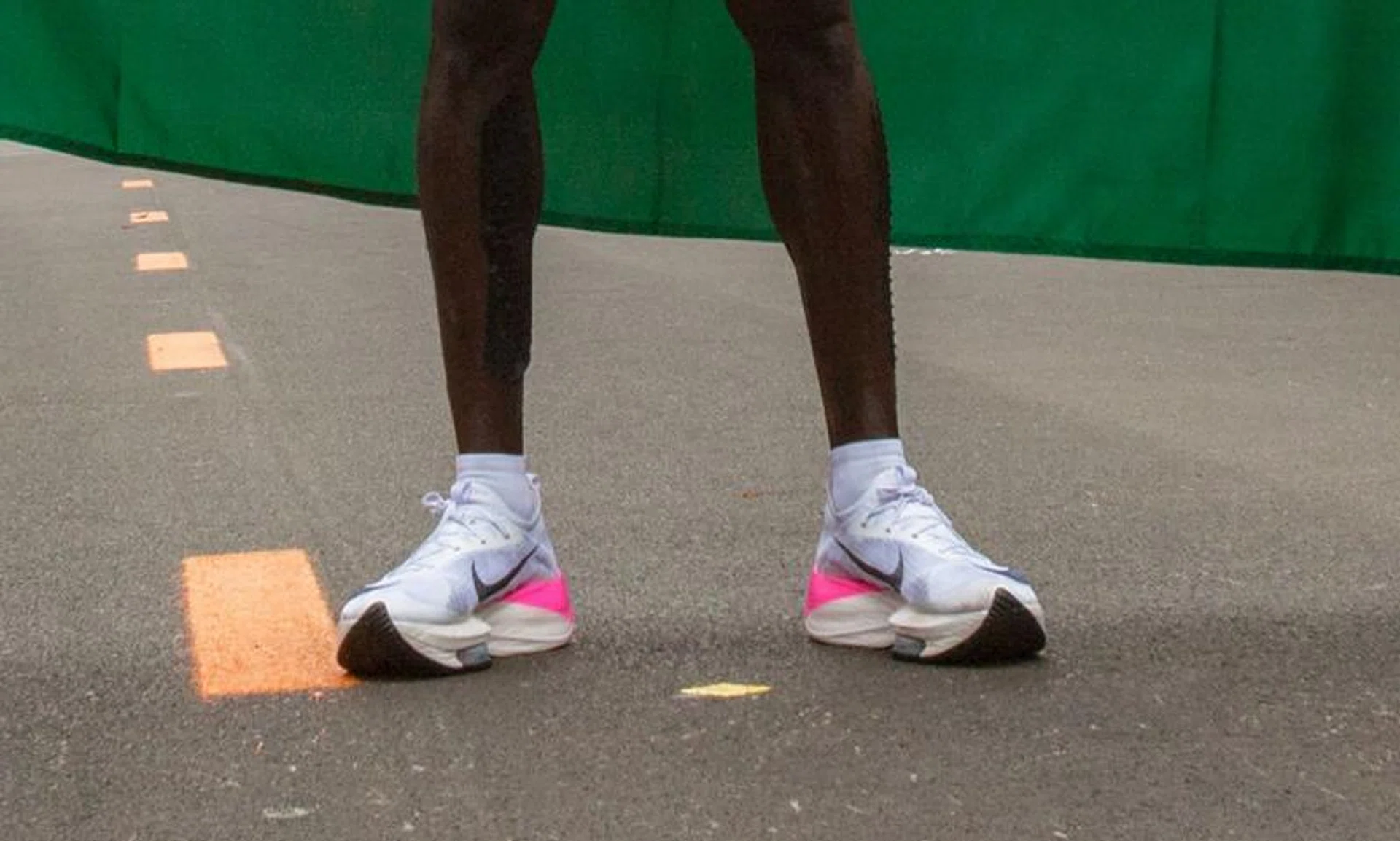 This file photograph taken on October 12, 2019, shows the running shoes of Kenya's Eliud Kipchoge as he stands after his attempt to break the two-hour barrier for the marathon at The Reichsbrücke in Vienna.