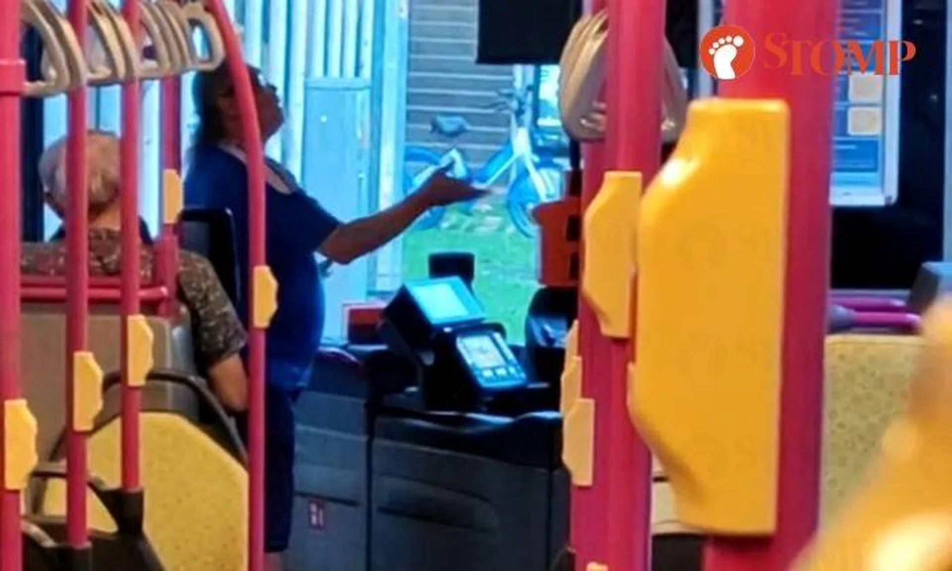 In the video, a man in a blue Chelsea football club jersey stood next to the bus driver and ranted.