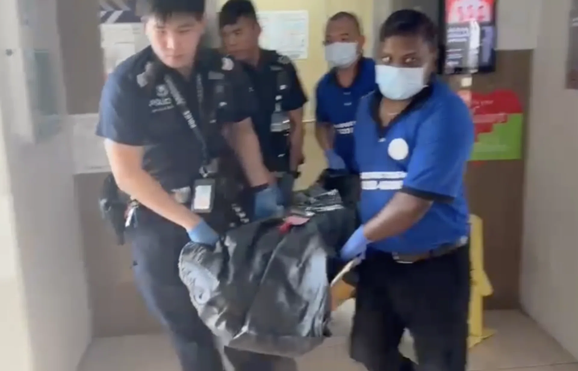 The body of the victim being removed after 4pm.