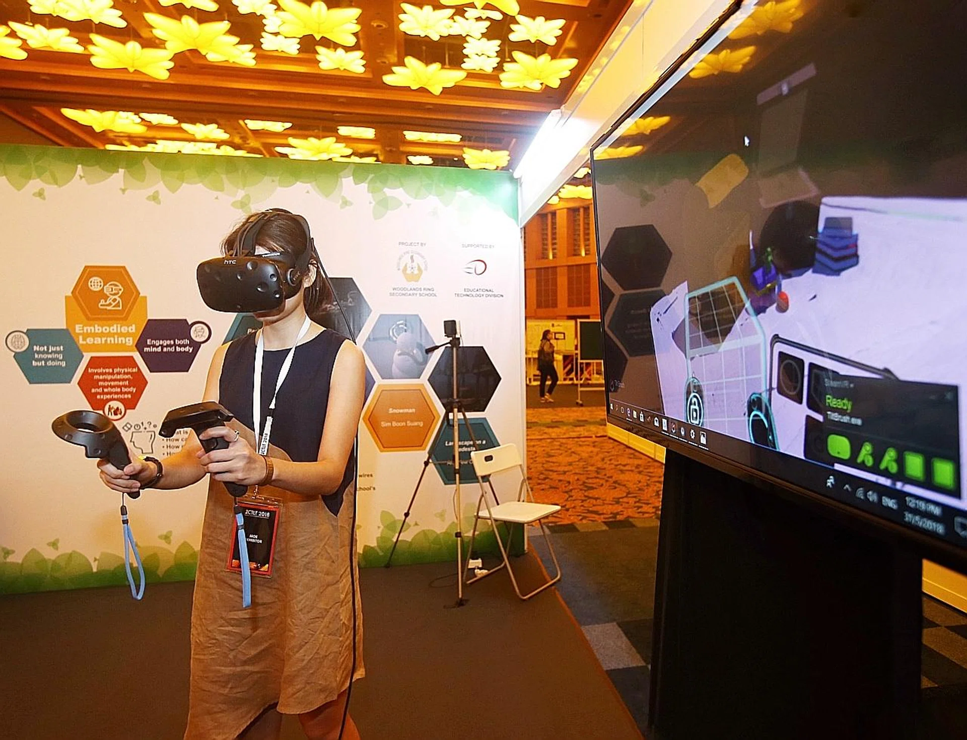 Ms Deborah Ong from Woodlands Ring Secondary School demonstrating how to use Virtual Reality technology to create 3D art at this year's International Conference on Teaching and Learning with Technology. 