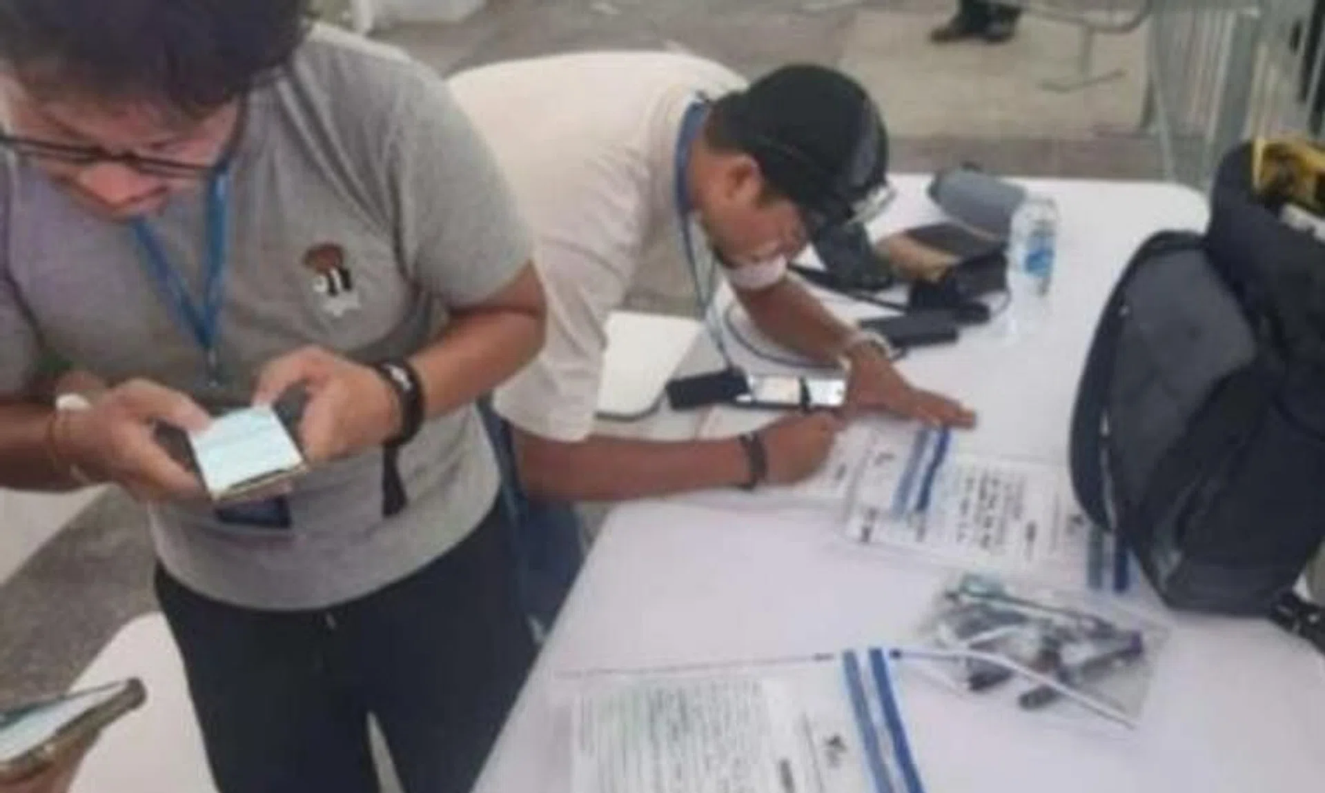 Health Sciences Authority officers conducting an operation at ZoukOut 2023, where 176 people were caught using e-vaporisers.
