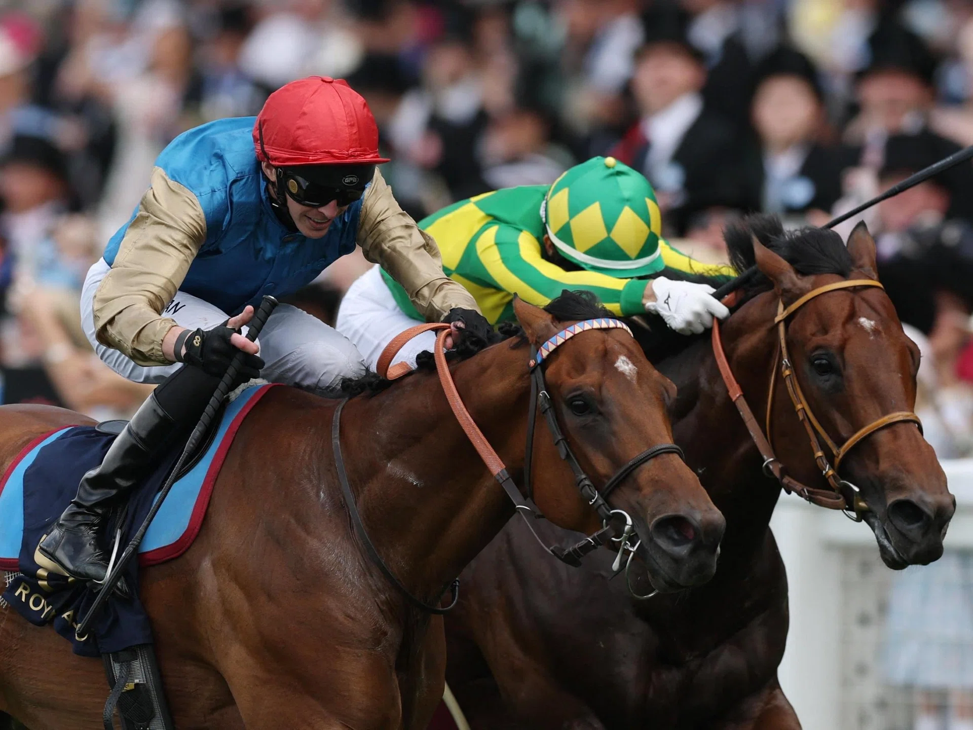 French galloper Lazzat (James Doyle, red cap) staving off Japanese runner Satono Reve (Joao Moreira) to claim the Group 1 Queen Elizabeth II Jubilee Stakes (1,200m) at Royal Ascot on June 21.
