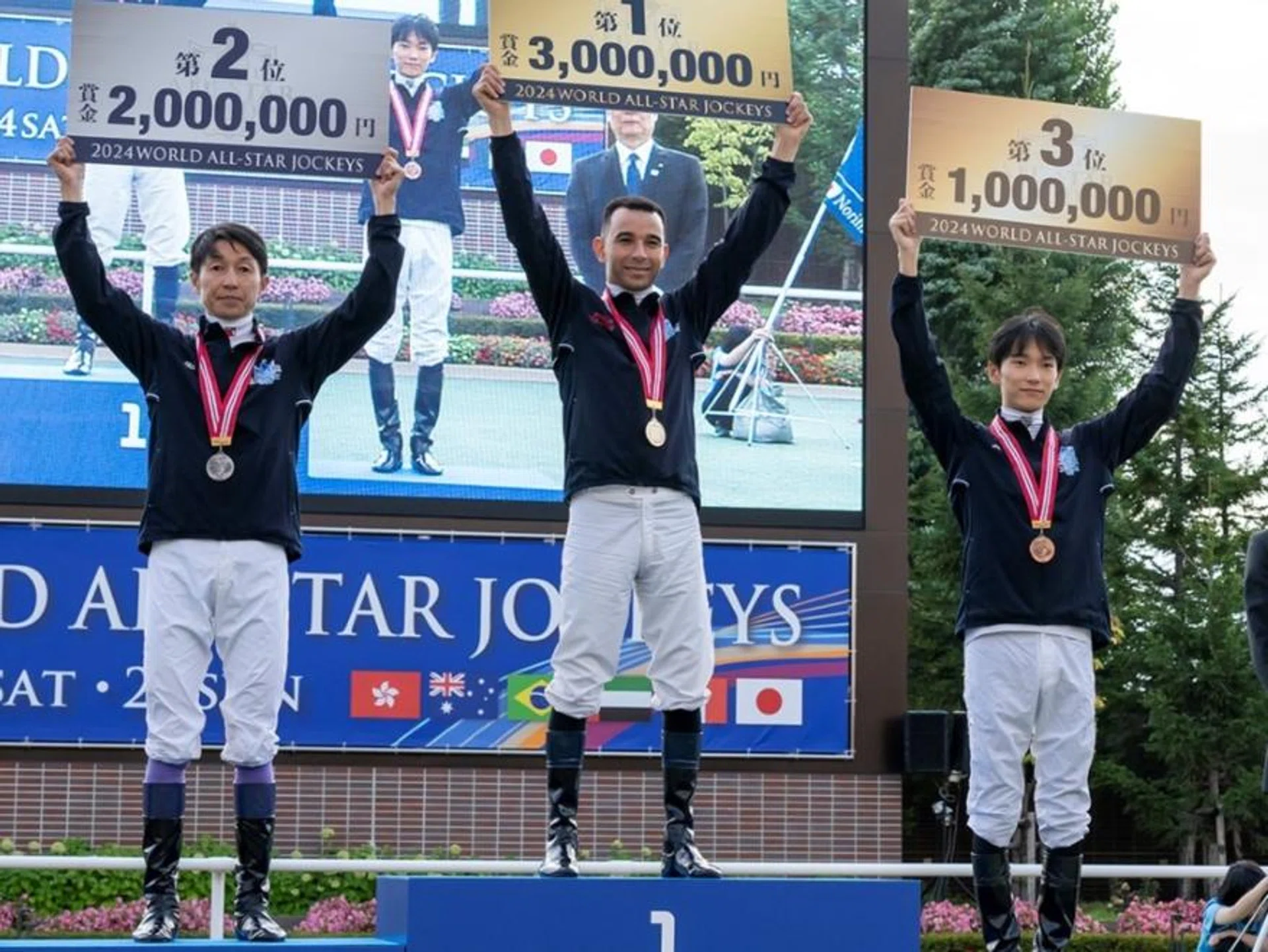 Brazilian jockey Joao Moreira standing on top of the podium at the conclusion of the World All-Star Jockeys series in Sapporo on Aug 25. Japanese jockeys Yutaka Take (left) and Ryusei Sakai finished second and third respectively.
