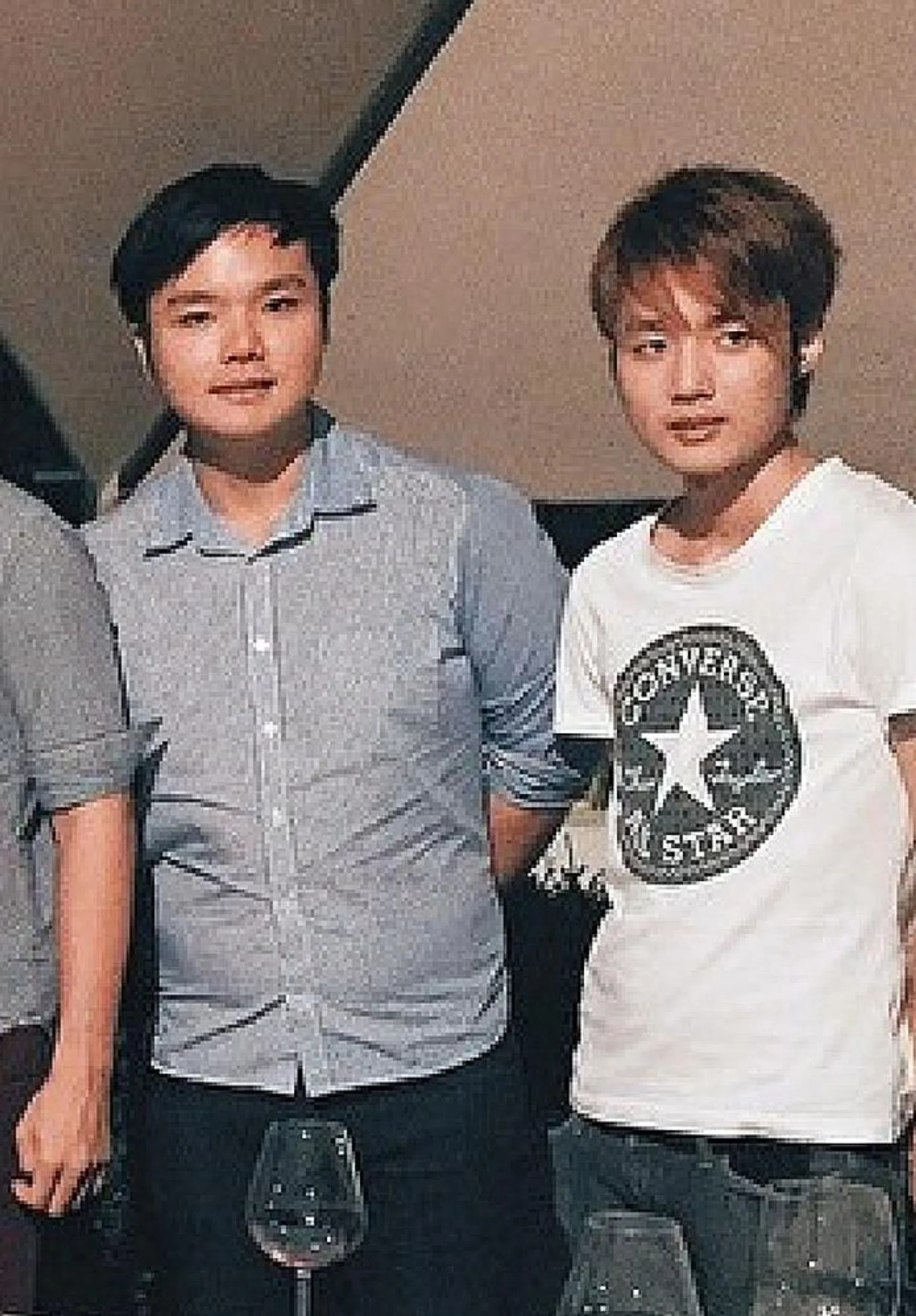 BROTHERS: Ng Yao Wei (above, right) stabbed his brother Ng Yao Cheng (left) 22 times, including seven times in the neck.
