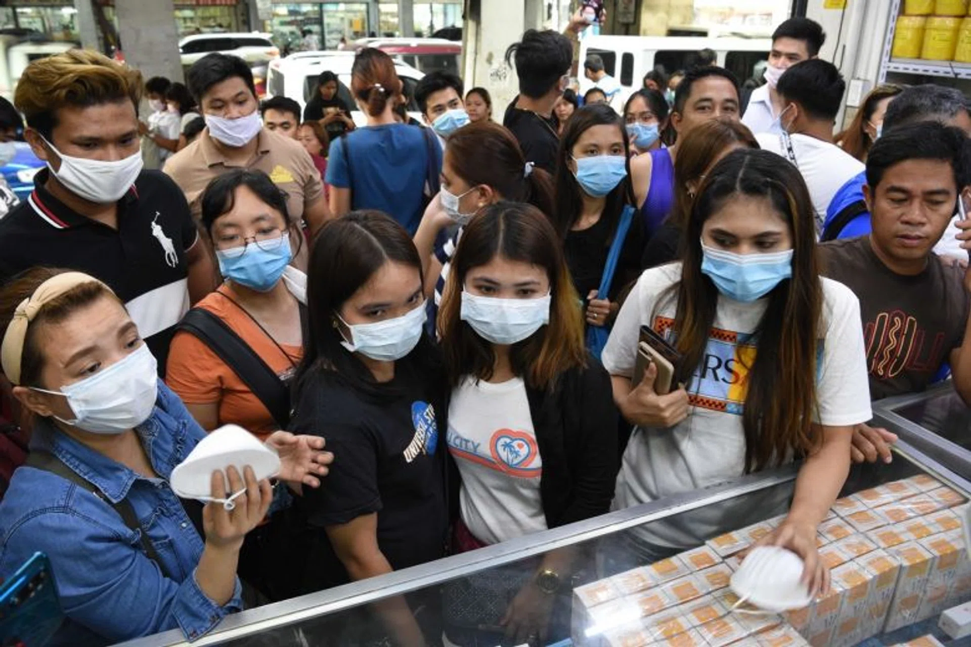 People buying protective masks at a medical supplies store in Manila on Jan 31, 2020.