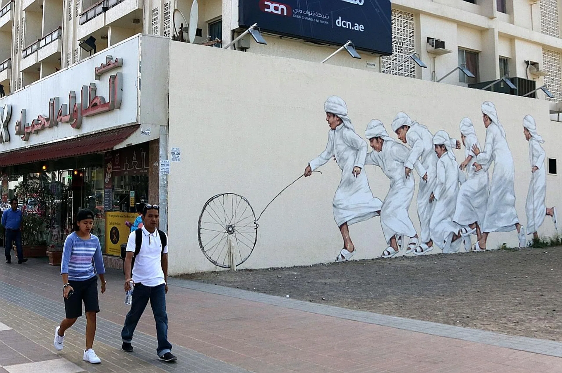 The artwork includes graffiti by Lithuanian artist Ernest Zacharevic.