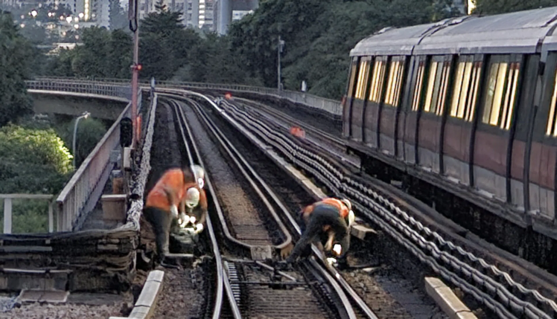 SMRT staff checking the tracks.