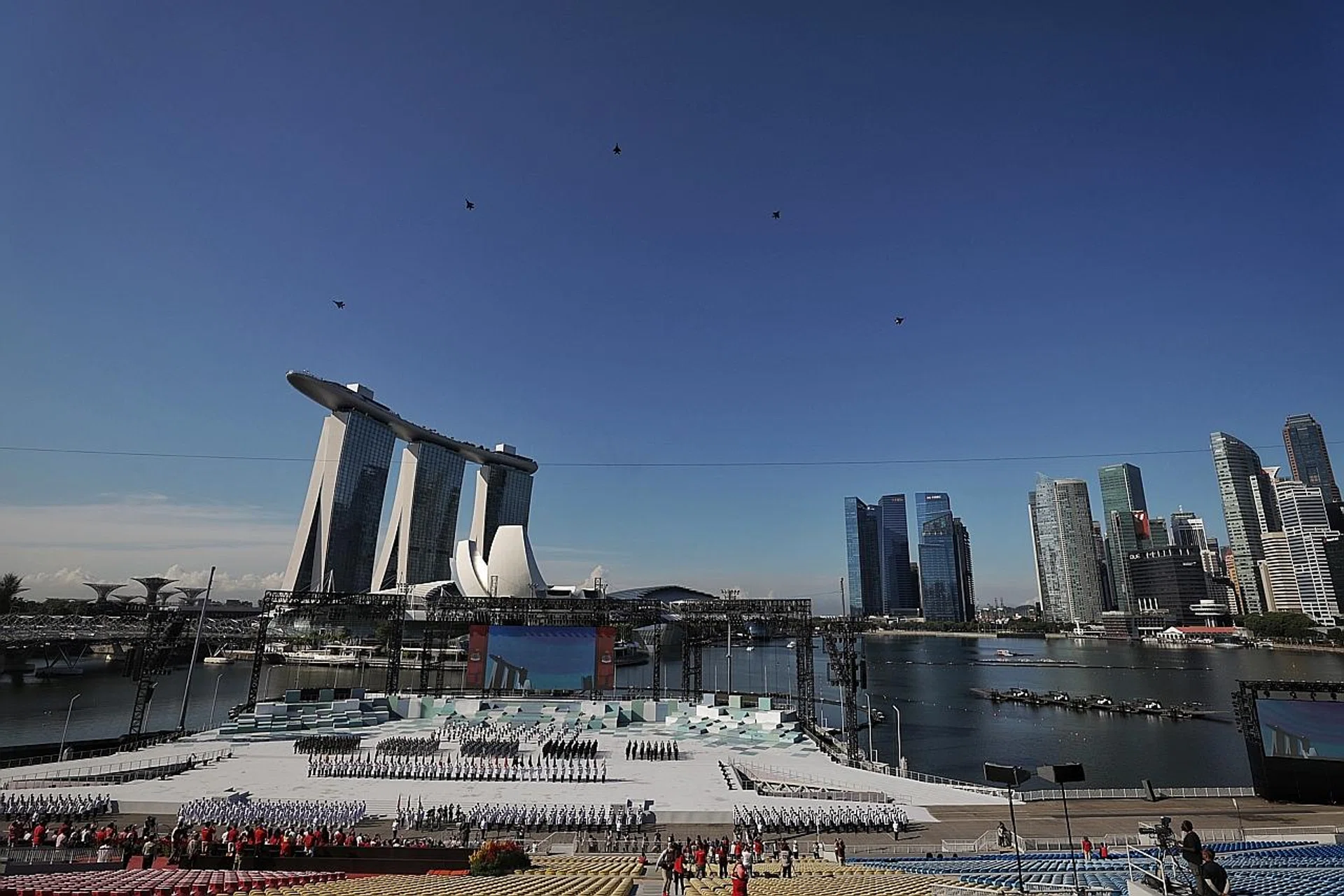 The National Day ceremonial parade at The Float @ Marina Bay yesterday morning.