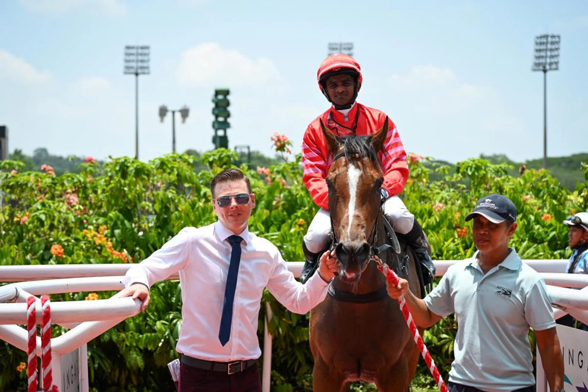 Rubik Kid (Krisna Thangamani) brought to his first visit to the winner's circle by his trainer James Peters after his win in the Open Maiden (1,200m) at Kranji on March 23.