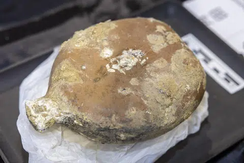 Close-up of a Japanese army type 94 water bottle that was found, marked with its owner's initials.