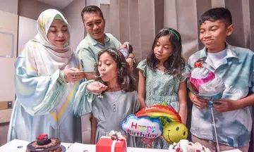 'We definitely did not plan it!': Couple celebrates four children born on the same day