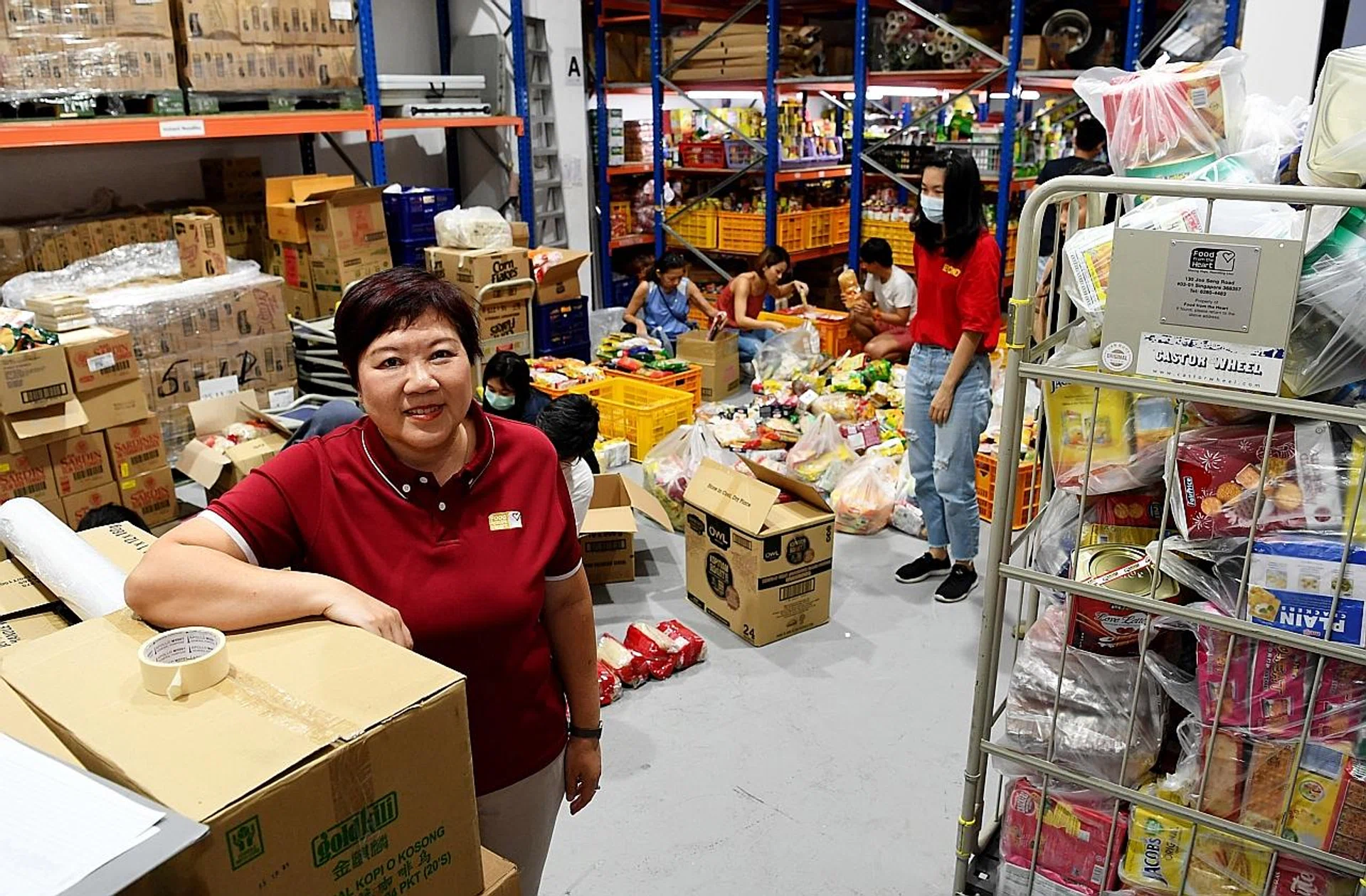 Ms Sim Bee Hia, chief executive of Food from the Heart, a charity that provides monthly food rations to families in need. 