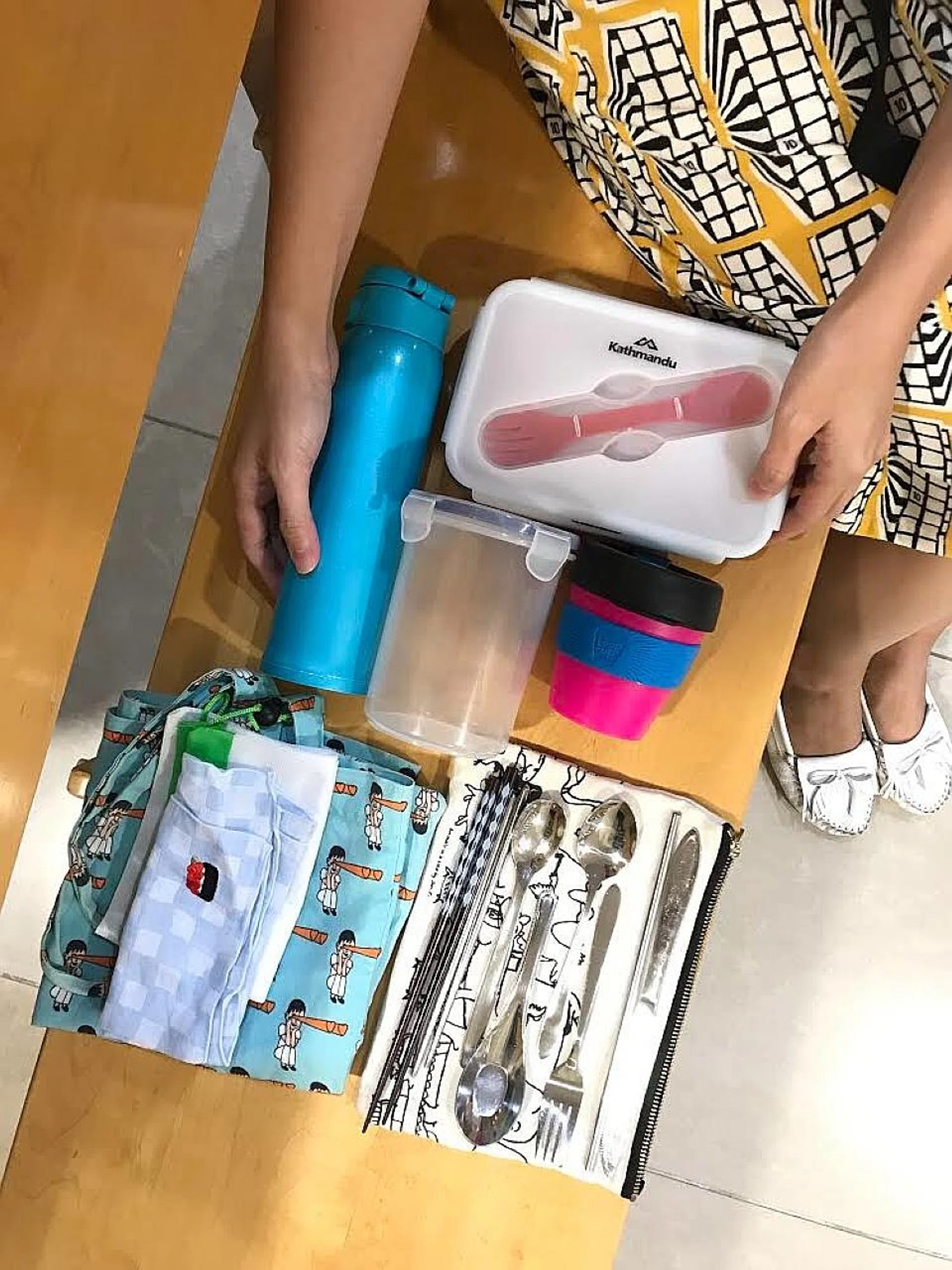 Miss Khee makes sure to have her kit of reusable containers and utensils whenever she leaves the house.