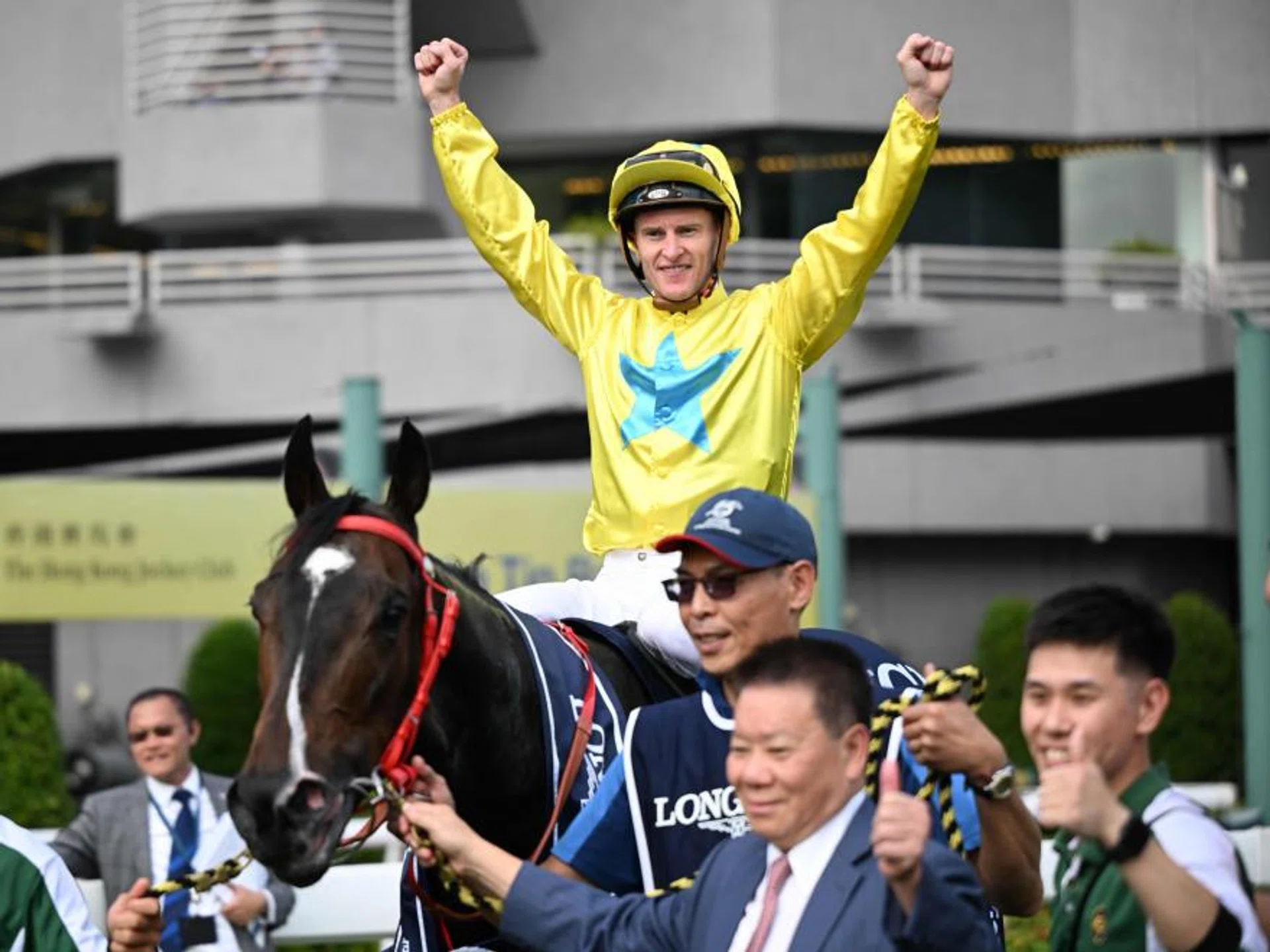 A jubilant jockey Zac Purton giving the V for Victory salute at the winner's enclosure after the Manfred Man-trained Lucky Sweynesse's triumph in the Group 1 Longines Hong Kong Sprint (1,200m) on Dec 10, 2023.