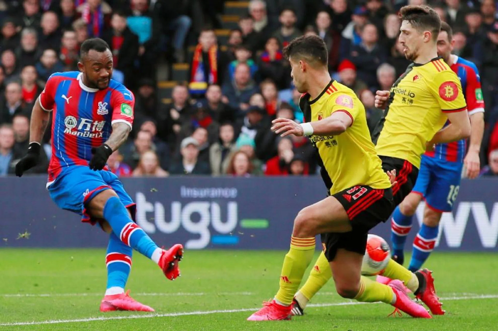 Crystal Palace striker Jordan Ayew (left) scoring in a 1-0 win over Watford in March, when the English Premier League came to a halt due to the Covid-19 outbreak.
