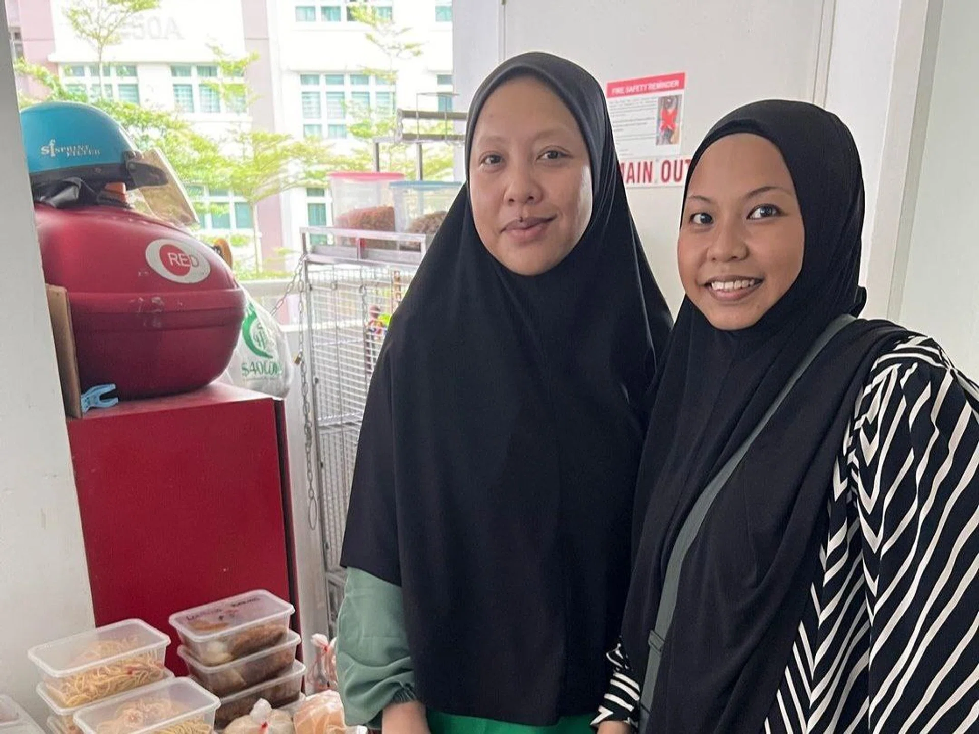 Razlina Razak (left) and her friend, Suhana Affendi. Razlina started her Free Food initiative at the start of Ramadan last month, where from 5.30pm to 6pm daily, 35 packets of food can be collected for free.