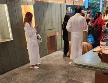 Couple spotted queuing at MBS cafe in bathrobes and bedroom slippers
