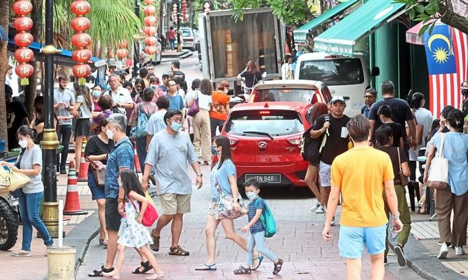 The crowds are larger than usual due to the school holidays on both sides of the Causeway. 