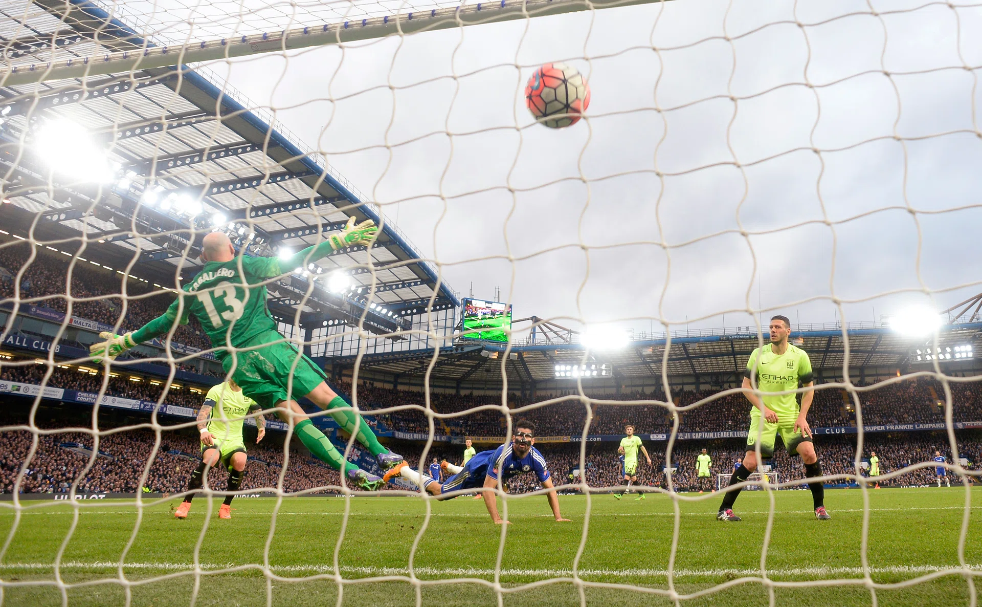 BLUES OPENER: Diego Costa (in blue) putting Chelsea ahead.