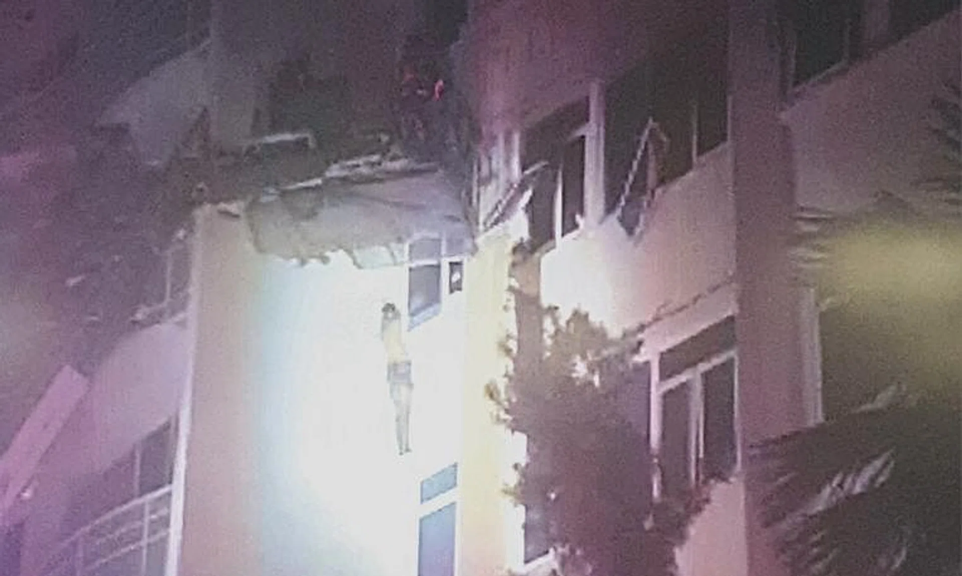 A combined platform ladder was deployed by firefighters to rescue the two persons seen standing precariously on a window ledge outside a unit at Sunflower Regency condominium on July 29.