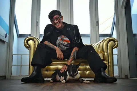 Fashion show producer and director Daniel Boey with his dog Luna. He is wearing a T-shirt with a print of his late dog Leia, from his new clothing label Furry Tales.