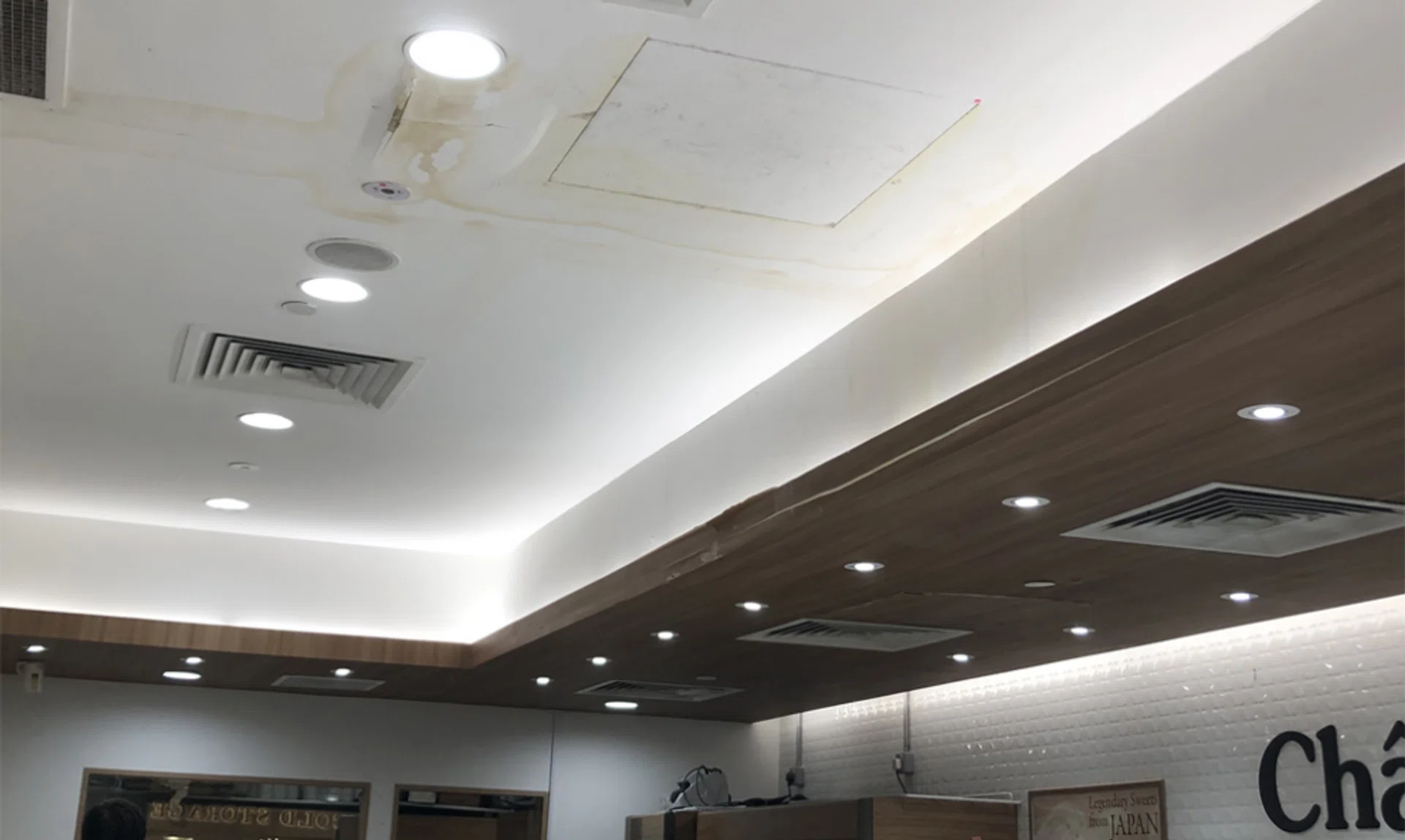 Yellow water stains could be seen on the ceiling of the shop.