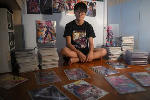 Galactus superfan Lael Lee pictured with part of his collection of comics and paraphernalia at his home on June 23, 2025.