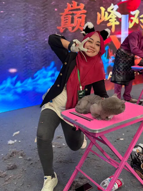 Ms Aziemah Zakiyyah Azmi created a dragon-inspired hairstyle on her munchkin cat model, Food Bucket, aiming for a culturally meaningful and visually impactful design.