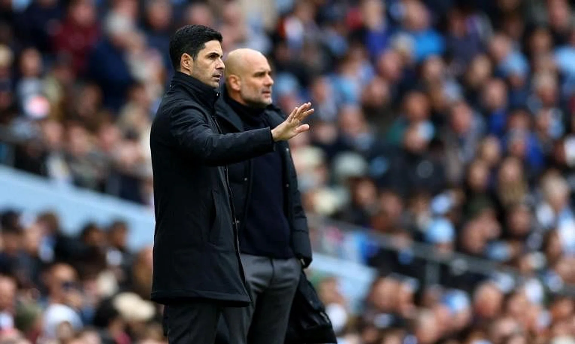 Arsenal manager Mikel Arteta (left) and Manchester City manager Pep Guardiola during the match in Manchester, on March 31.
