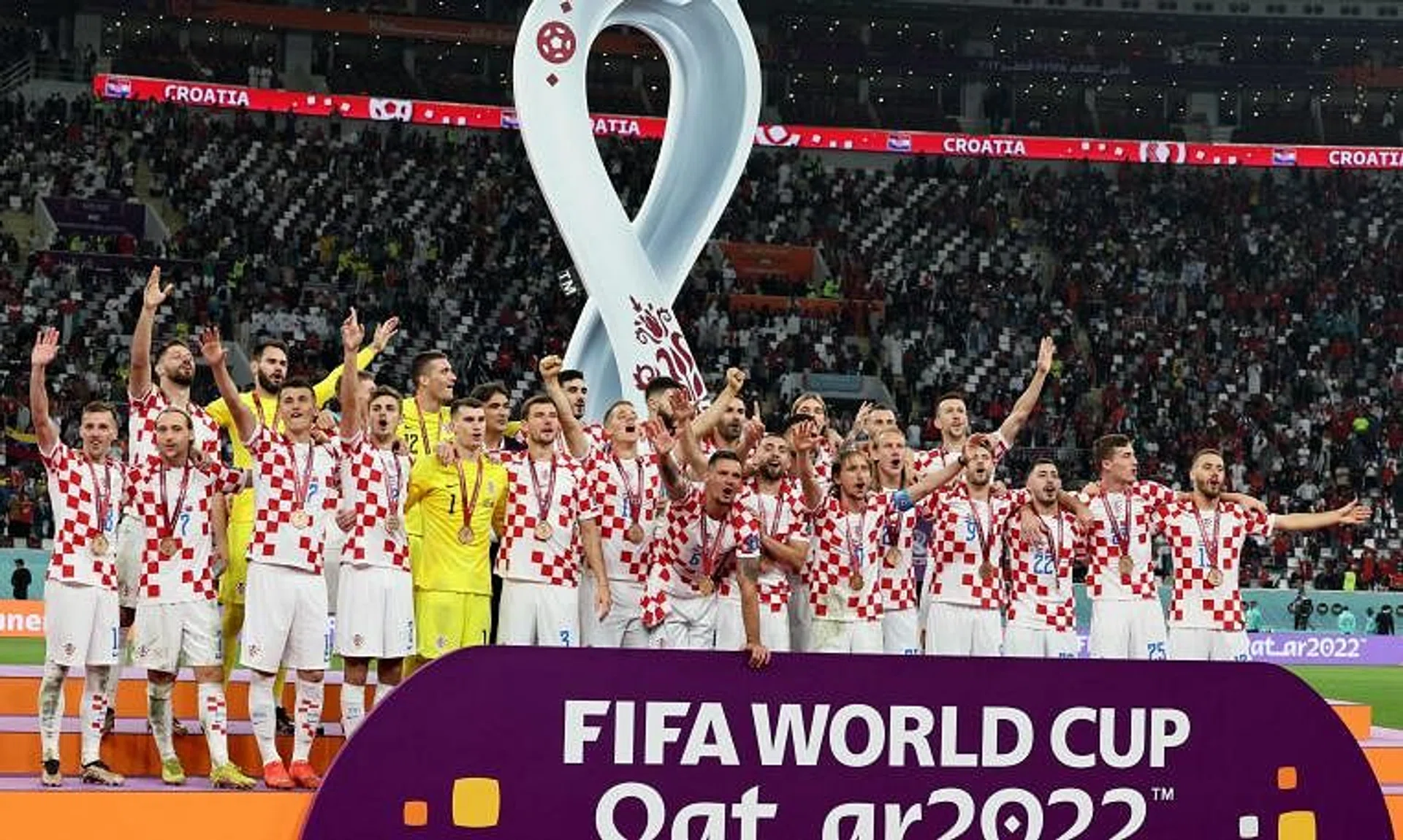 Croatia's players celebrate with their medals after winning the Qatar 2022 World Cup third place play-off against Morocco.