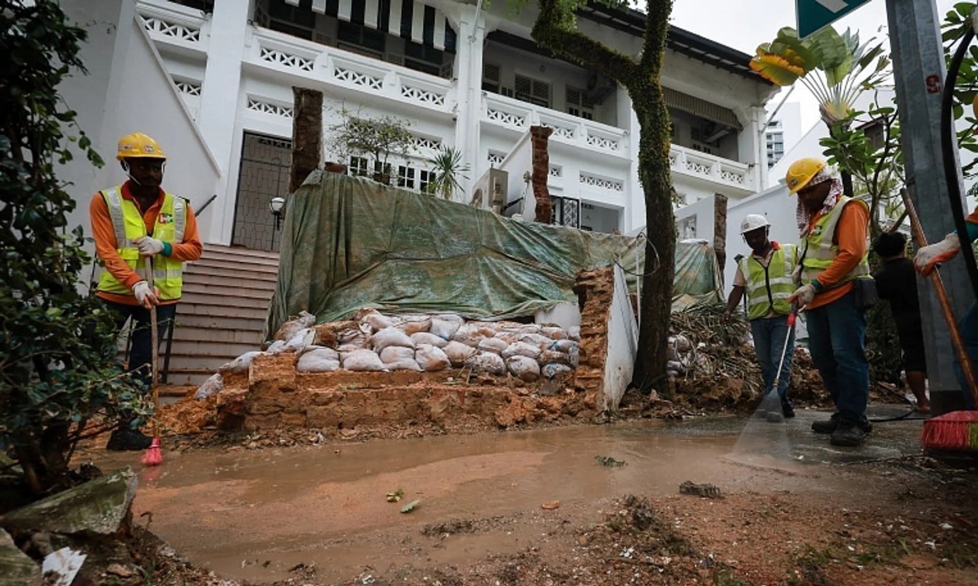 On Dec 29, a brick retaining wall at the front of two conserved terraced houses in Cairnhill Road collapsed amid the wet weather.