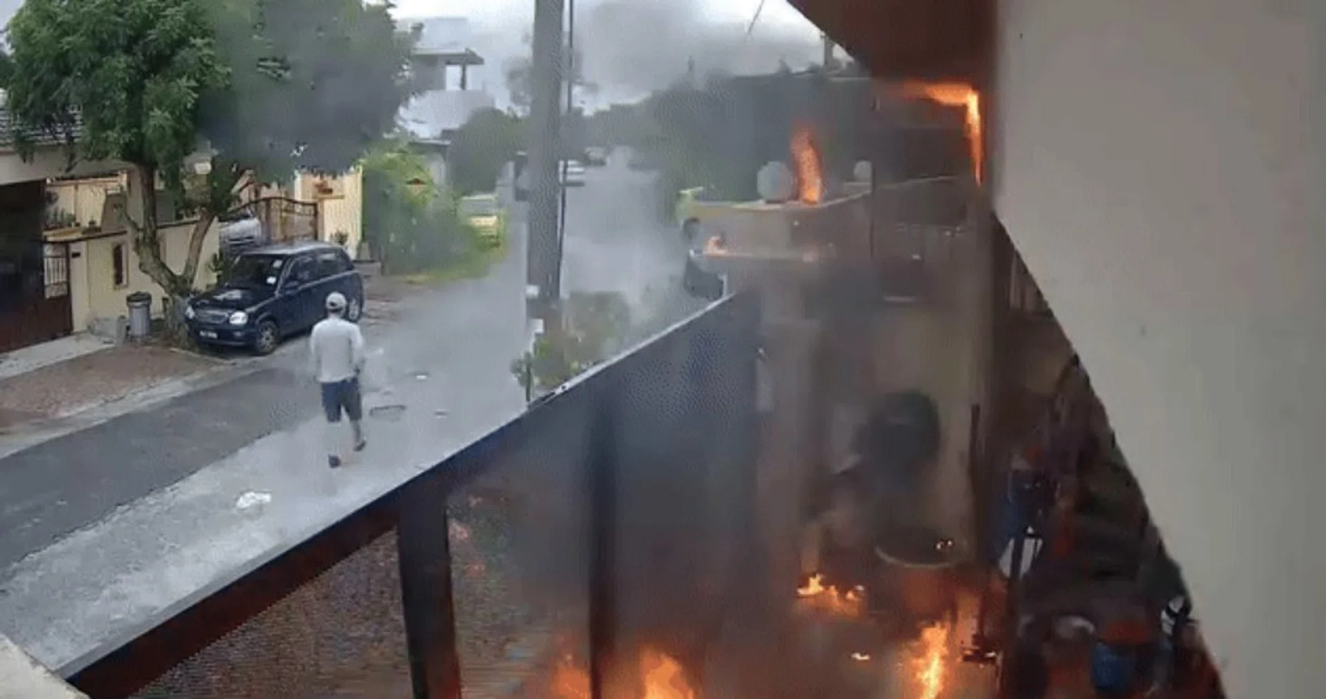 The man set the house on fire and recorded the scene while walking away.