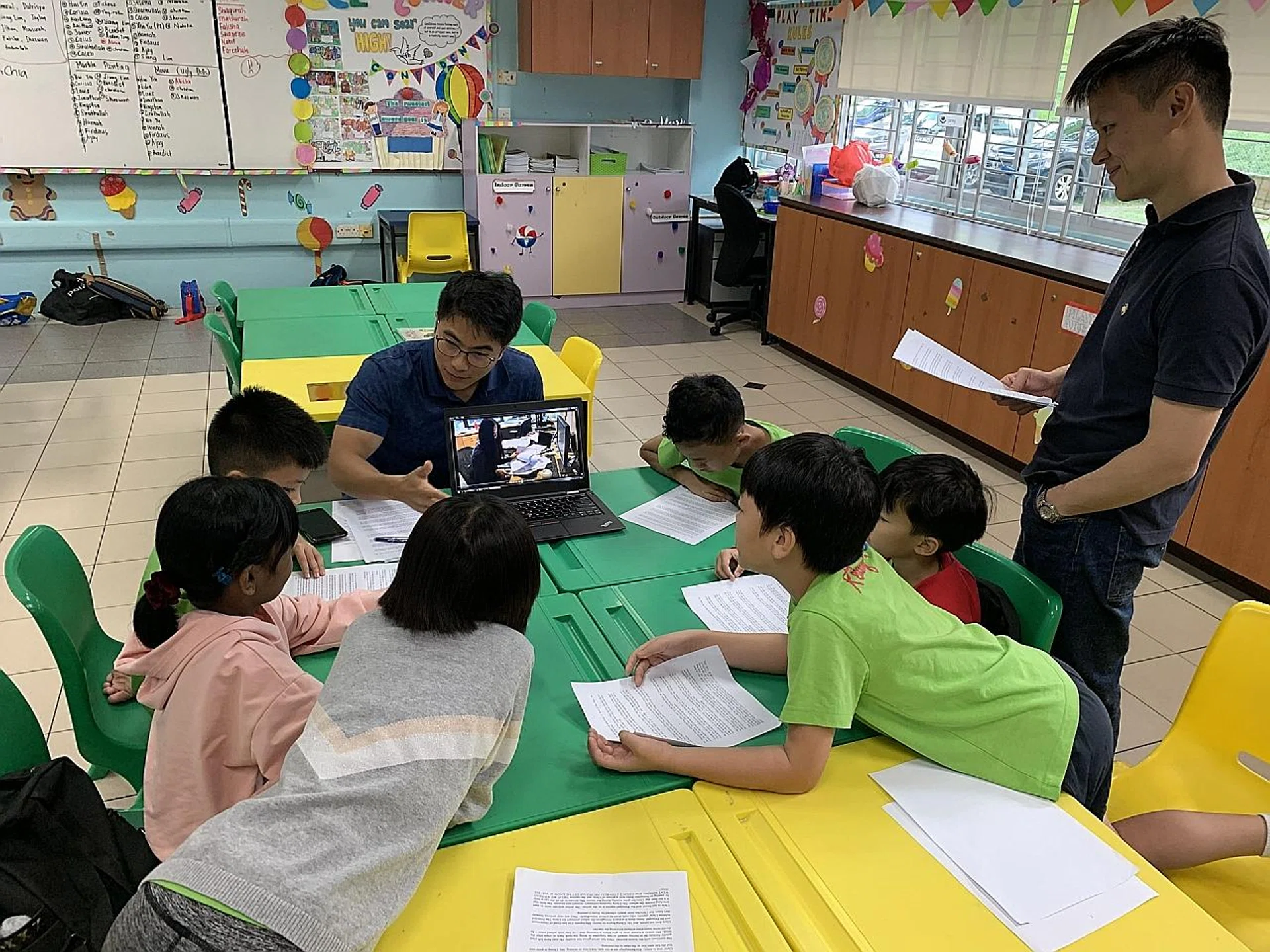 (Above) Shearman & Sterling law firm taking part in a workshop for needy children.