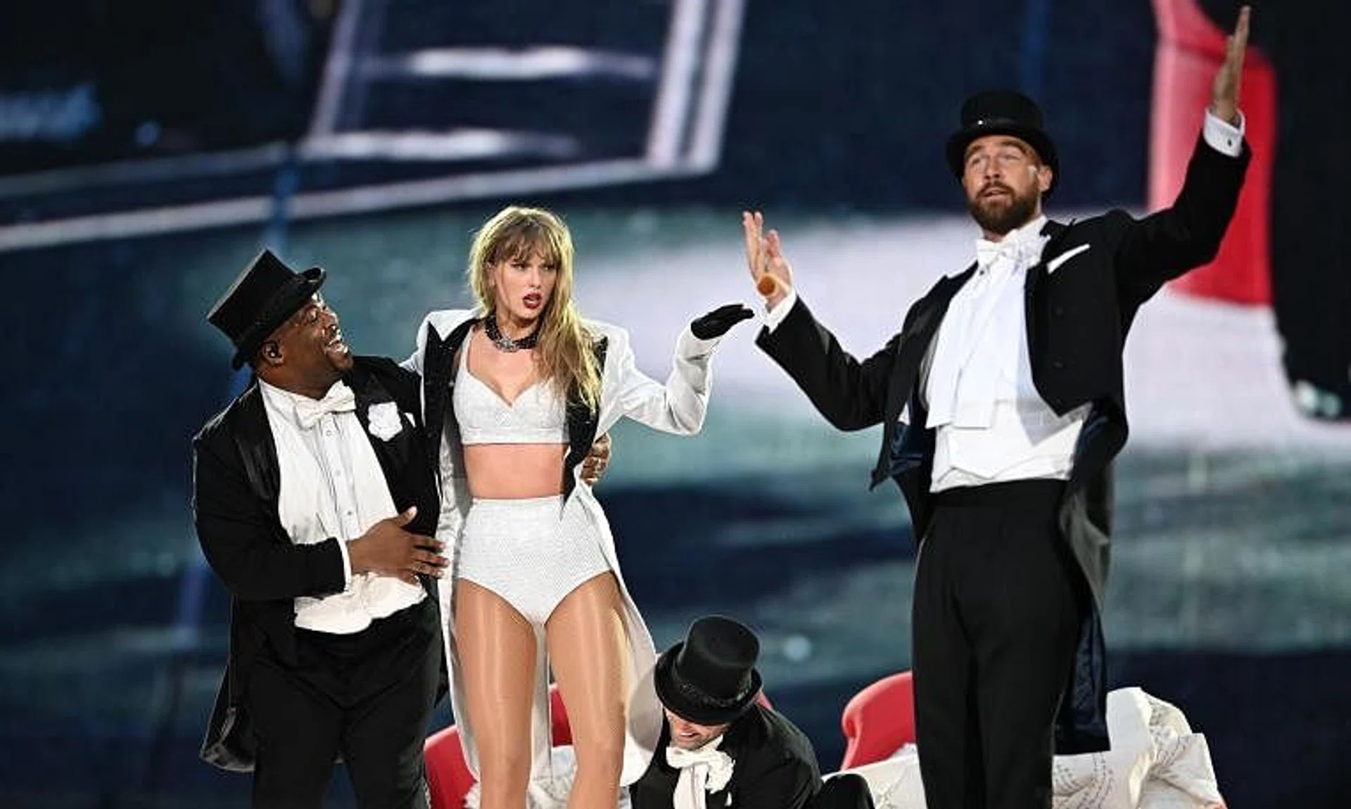 Taylor Swift is joined onstage by Travis Kelce (right) during The Eras Tour at Wembley Stadium in London, England, on June 23.