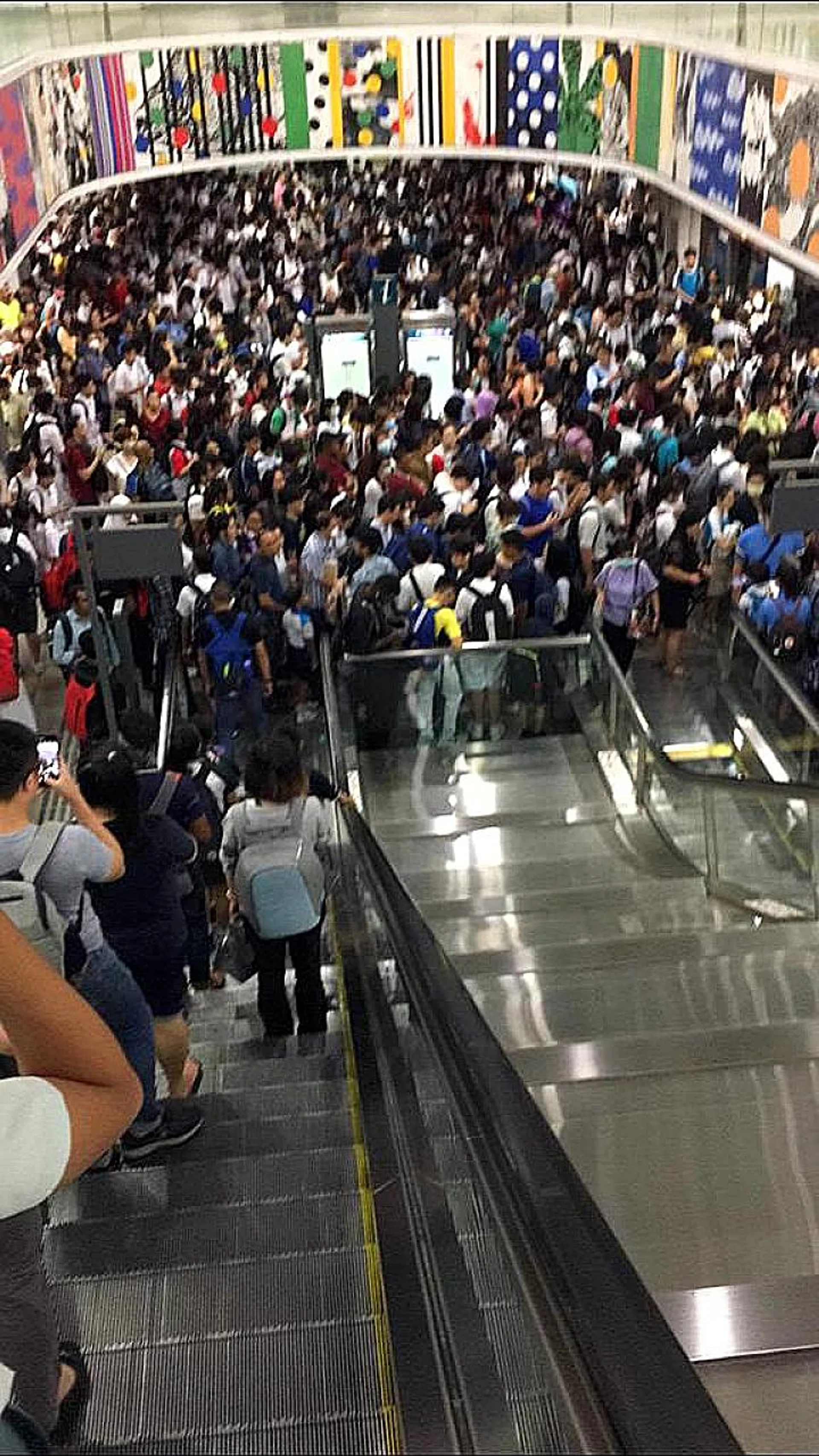 A shuttle train service and free bridging bus services did not completely ease the crowd build-up during peak hour at Punggol MRT station, one of the main hubs of the LRT networks. 
