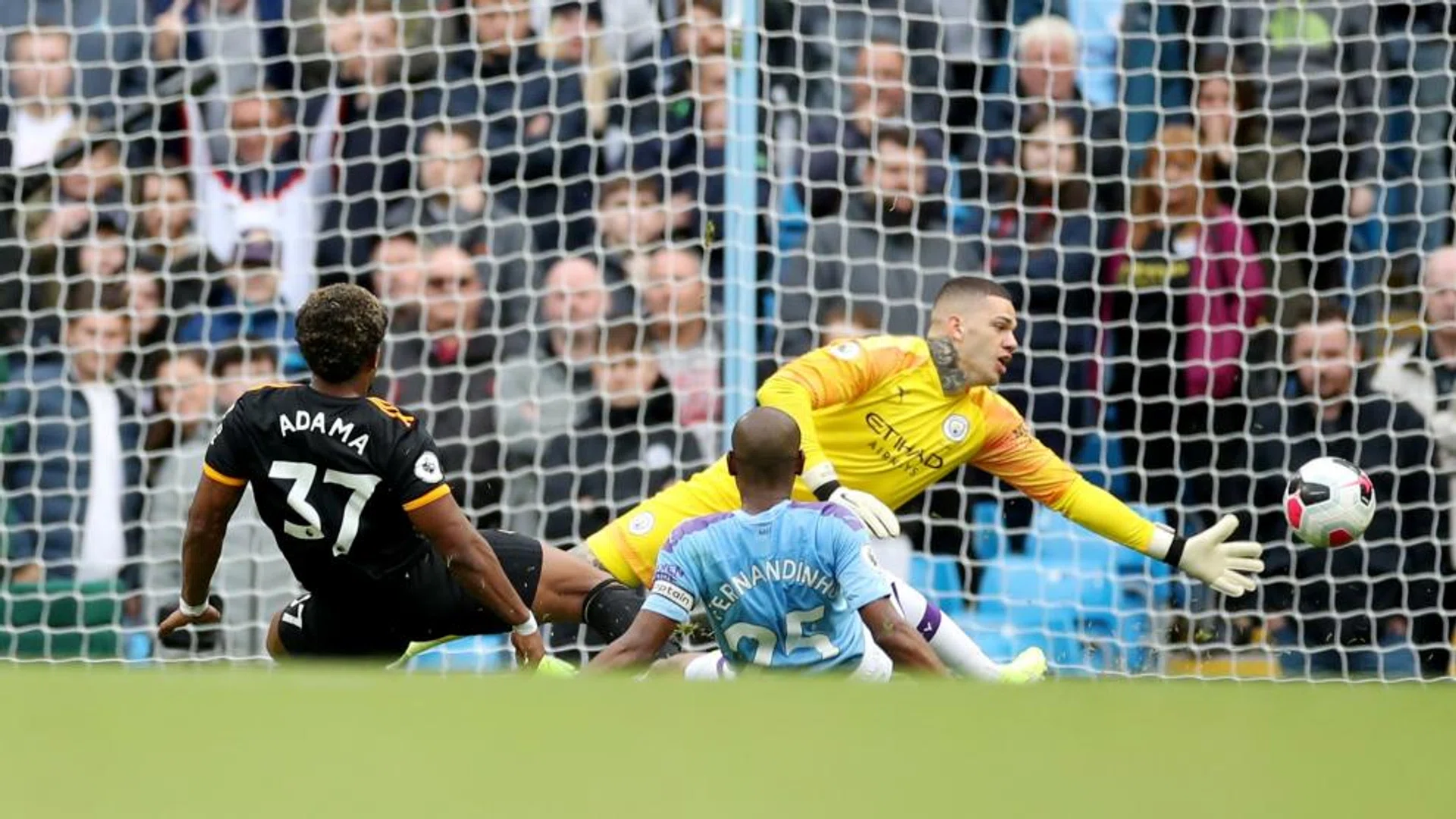 Adama Traore scoring Wolves' second goal past Manchester City goalkeeper Ederson.