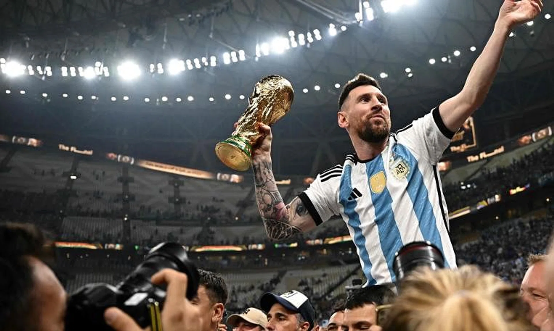 Argentina captain Lionel Messi lifting the World Cup trophy after a thrilling final against France.