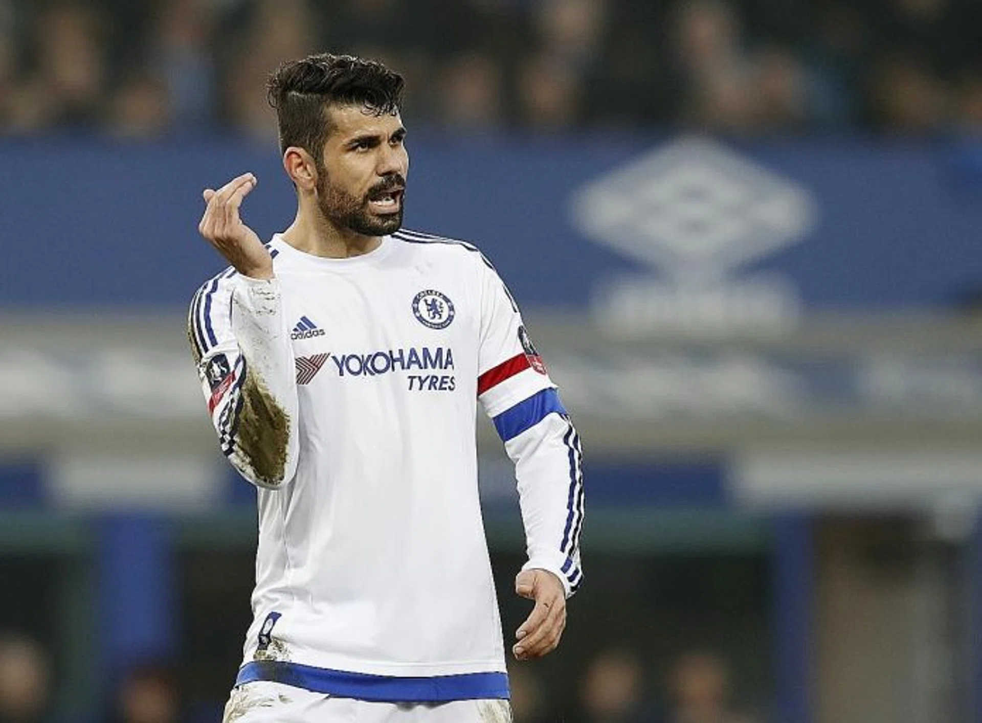 DEVIL OR  SAINT?  Chelsea's  Diego Costa (above) again courts controversy with his antics, including his gesture at the Everton fans.