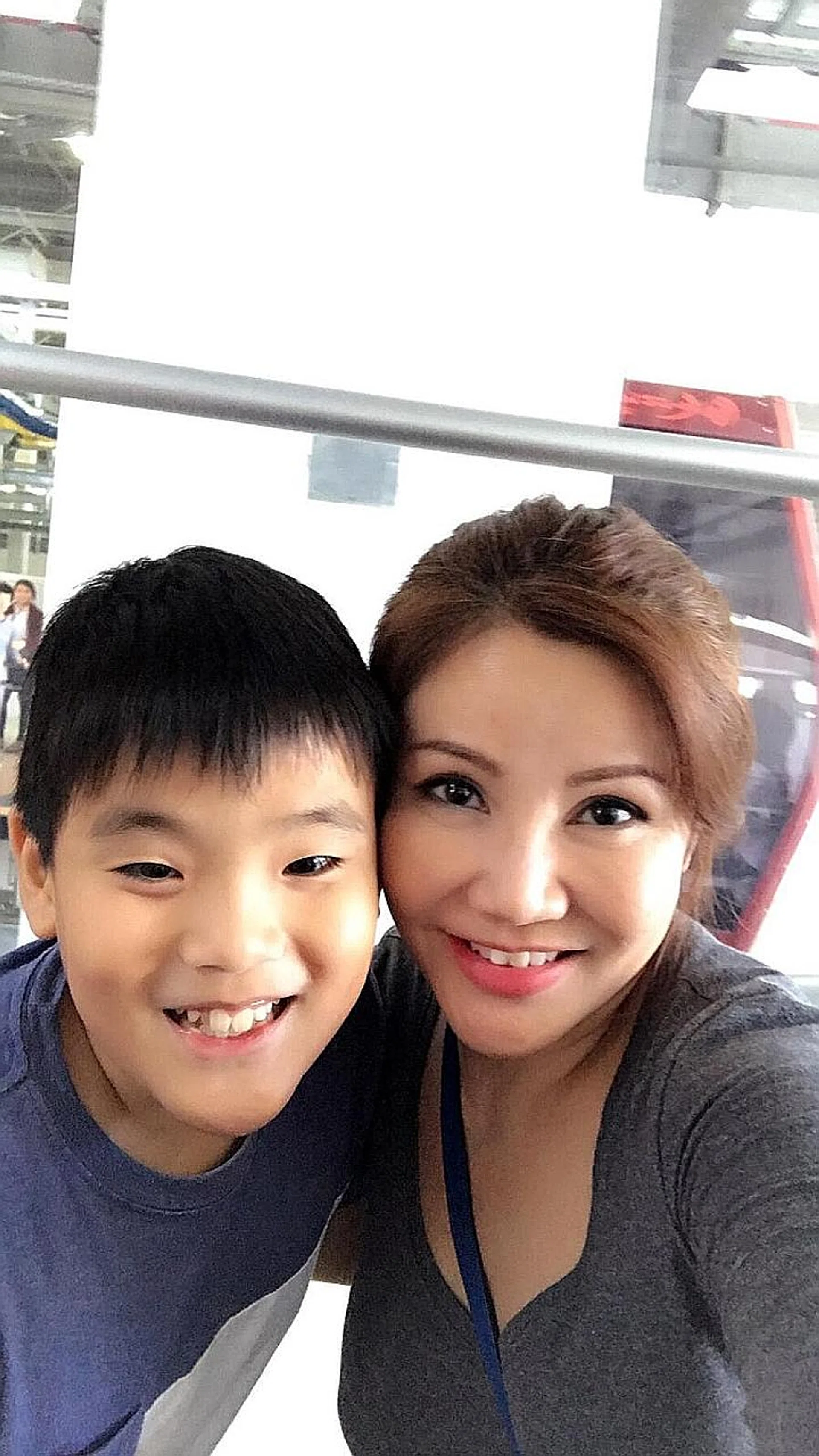 Ms Doreen Kho with her late son Evan, who suffered from depression and took his own life in 2017. 