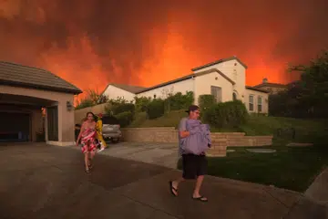 Californians flee as fire spreads